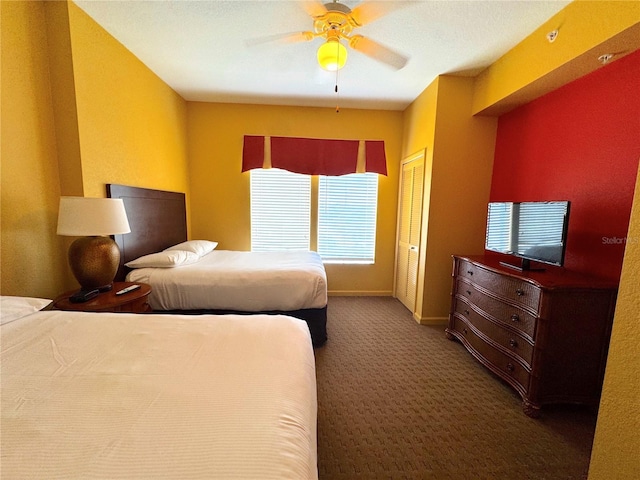 8100 Poinciana Blvd Unit B2/U2511, Orlando, FL 32821 - bedroom featuring baseboards, a closet, carpet floors, and a ceiling fan