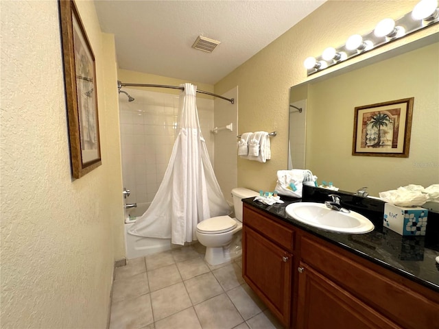 8100 Poinciana Blvd Unit B2/U2511, Orlando, FL 32821 - bathroom featuring tile patterned floors, toilet, vanity, visible vents, and a textured wall