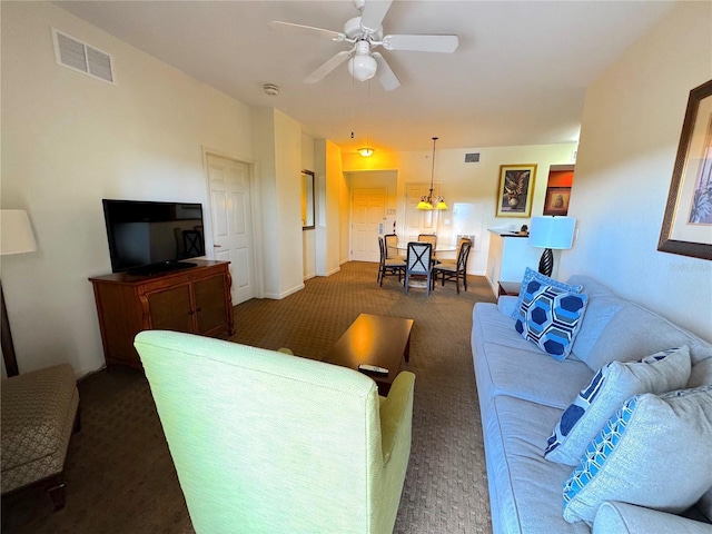 8100 Poinciana Blvd Unit B2/U2511, Orlando, FL 32821 - living area featuring dark carpet, ceiling fan, and visible vents