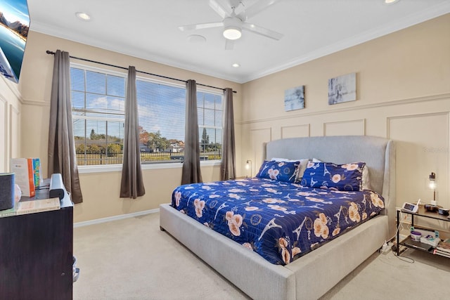 bedroom featuring light carpet, crown molding, and ceiling fan