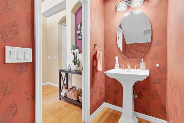 bathroom with hardwood / wood-style flooring