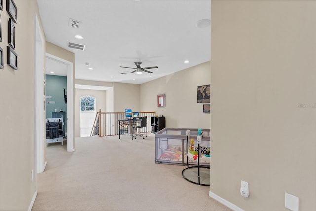 office area featuring ceiling fan and carpet flooring