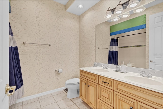 bathroom featuring vanity, curtained shower, tile patterned floors, and toilet