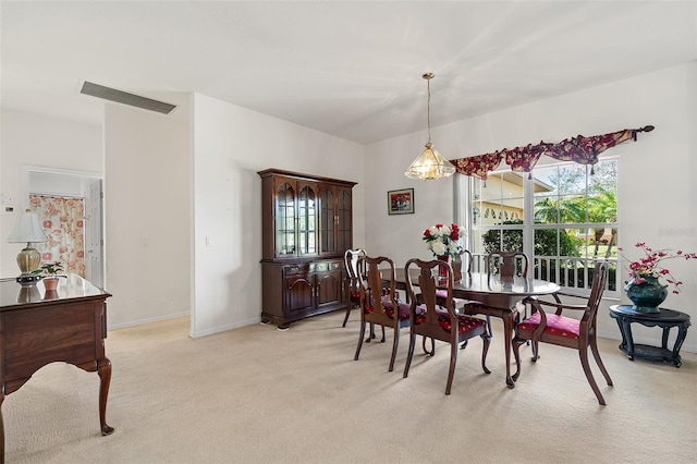 dining area with light colored carpet