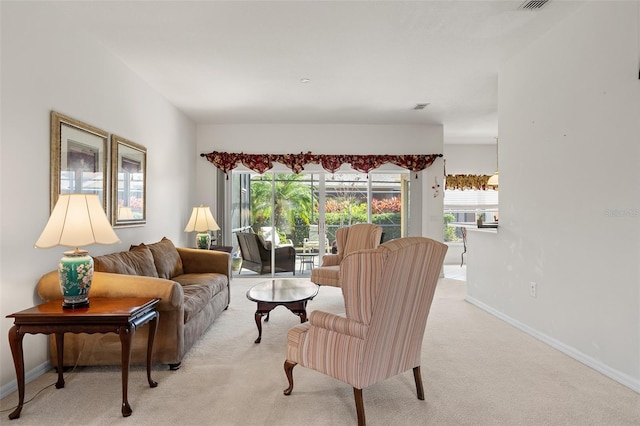 living room featuring light carpet