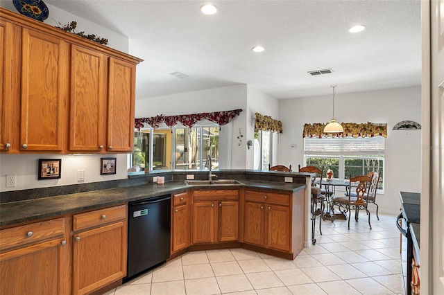 kitchen with dishwasher, sink, light tile patterned floors, kitchen peninsula, and a healthy amount of sunlight