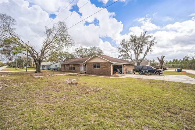 view of front of property featuring a garage and a front lawn