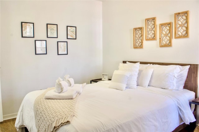 bedroom featuring dark hardwood / wood-style flooring