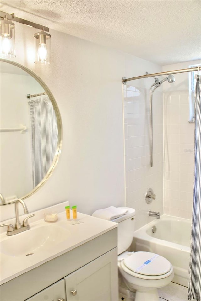 full bathroom with tile patterned flooring, vanity, toilet, shower / bath combo, and a textured ceiling