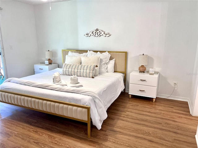 bedroom featuring dark hardwood / wood-style floors