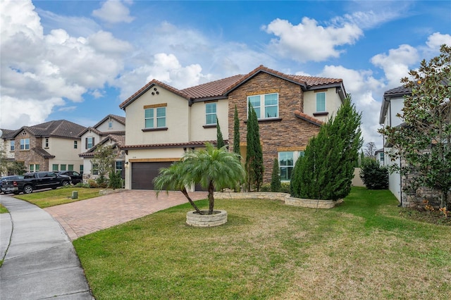 mediterranean / spanish-style home with a garage and a front lawn