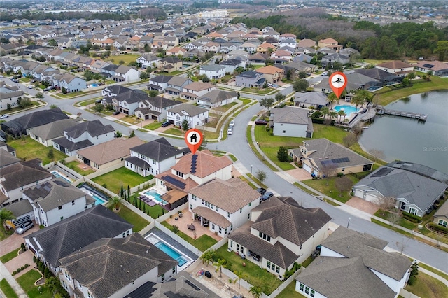 birds eye view of property featuring a water view