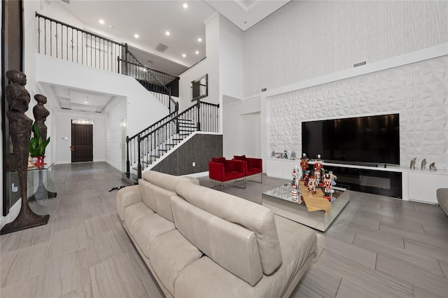 living room with a towering ceiling