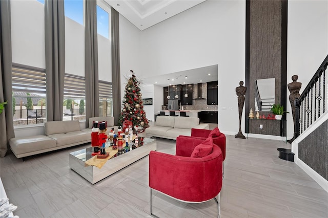 living room featuring a towering ceiling