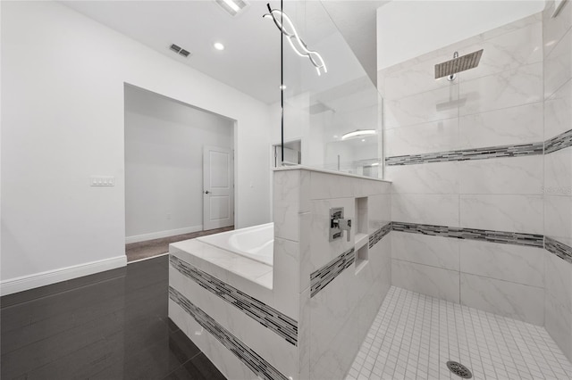 bathroom featuring a tile shower