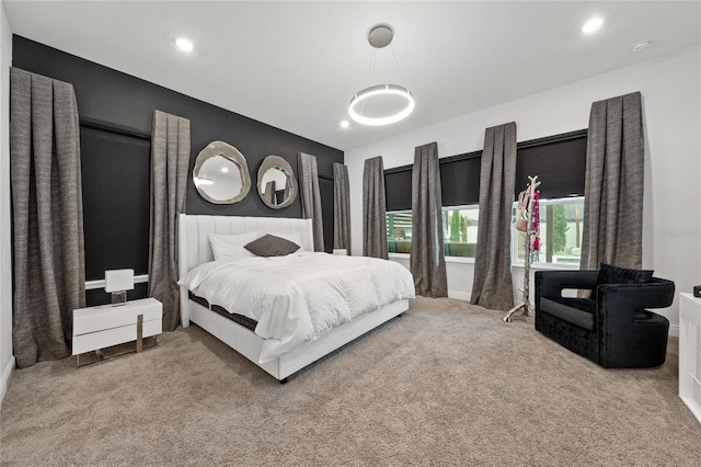 bedroom with light colored carpet