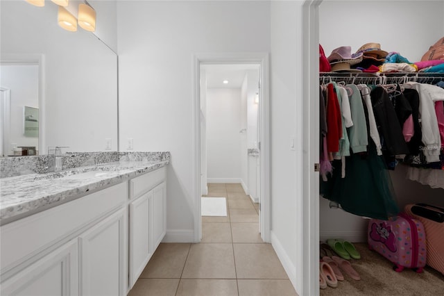 bathroom with tile patterned floors and vanity