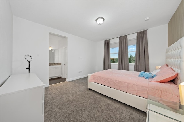 carpeted bedroom featuring ensuite bathroom