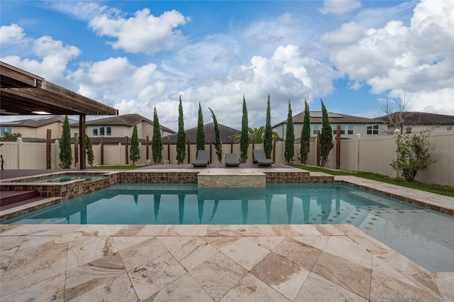 view of pool with an in ground hot tub and a patio area