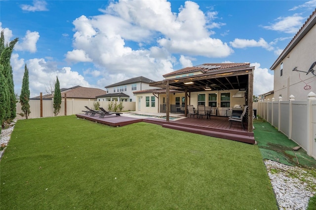 back of property featuring a swimming pool side deck and a yard