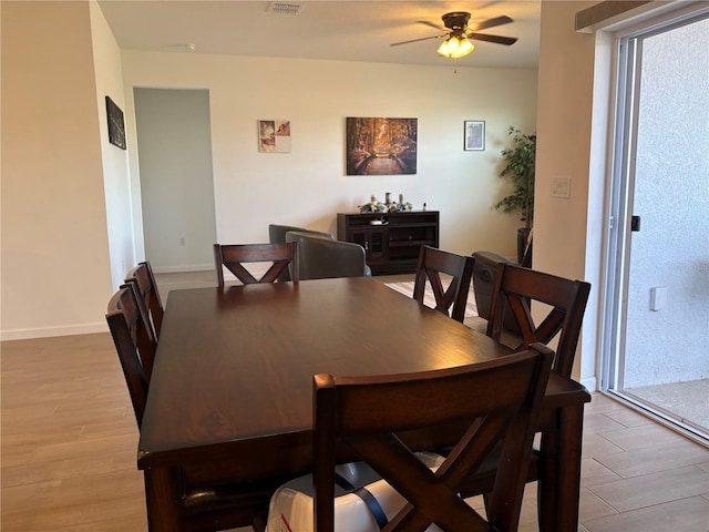 dining area featuring ceiling fan and light hardwood / wood-style flooring