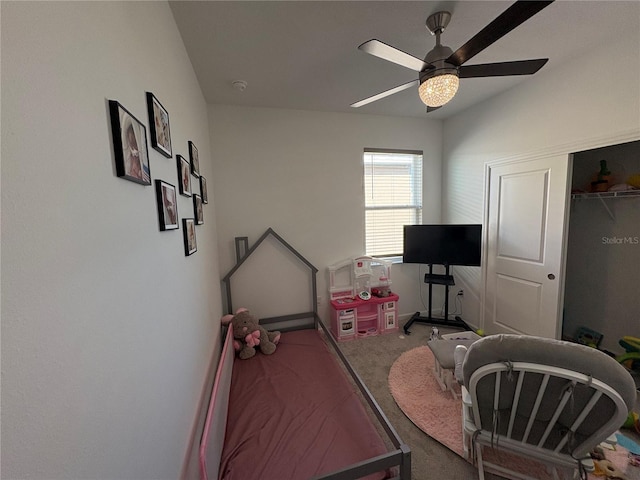 carpeted office space with ceiling fan