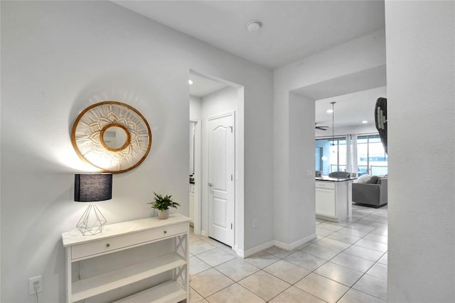 hallway featuring light tile patterned flooring