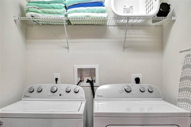 laundry area with washing machine and dryer