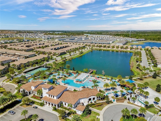 birds eye view of property with a water view