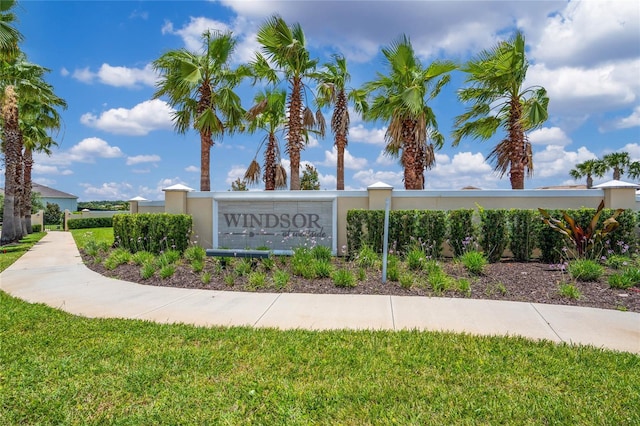 community sign featuring a lawn