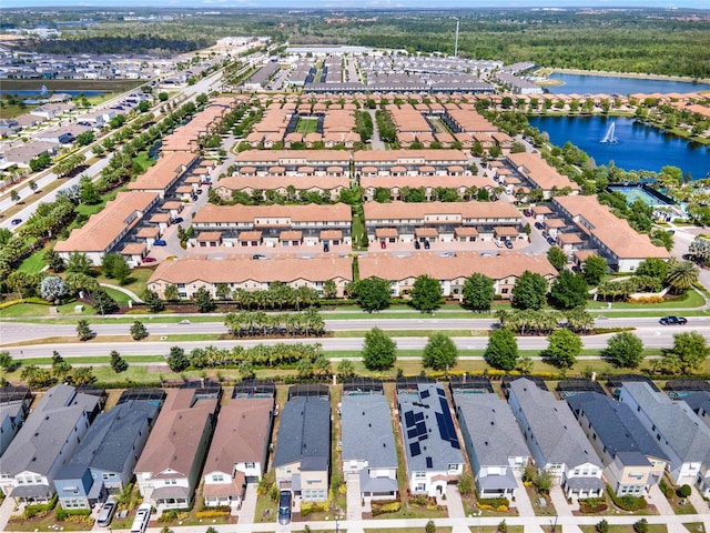 birds eye view of property with a water view