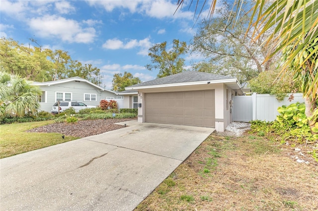 ranch-style home with a garage and a front yard