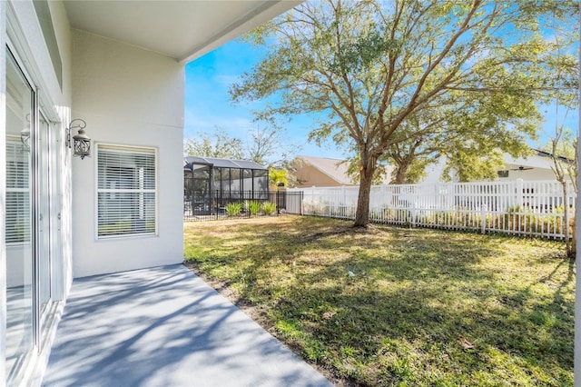 view of yard with a lanai