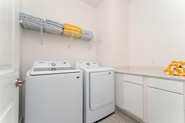 washroom with washing machine and clothes dryer