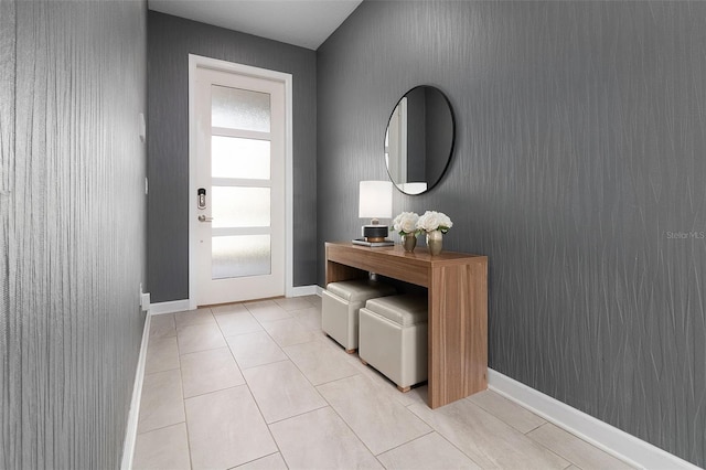 entryway with light tile patterned floors