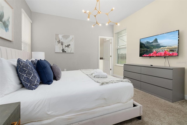 carpeted bedroom with a notable chandelier