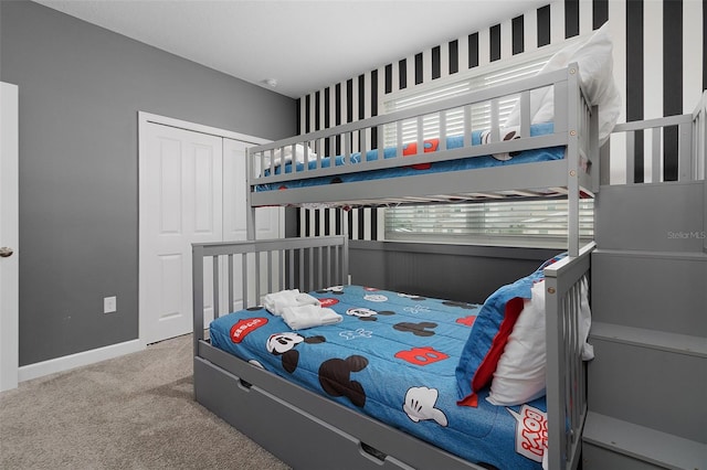 bedroom with carpet floors and a closet