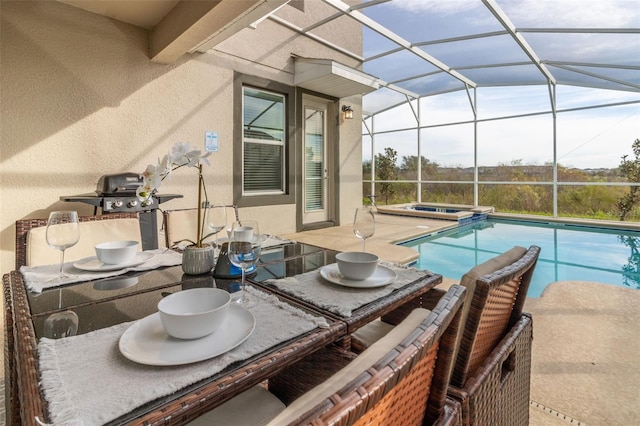 view of swimming pool with a lanai, a patio, and an in ground hot tub