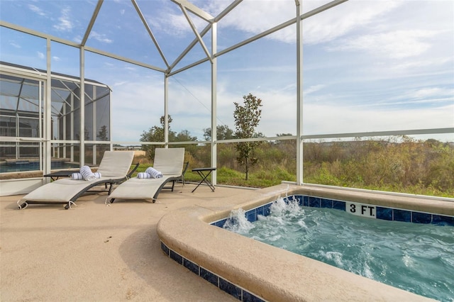 view of pool with a hot tub, a patio area, and glass enclosure