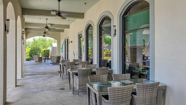 view of patio / terrace featuring ceiling fan