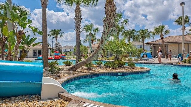 view of pool featuring a water slide