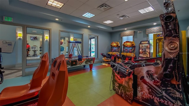 game room featuring a drop ceiling