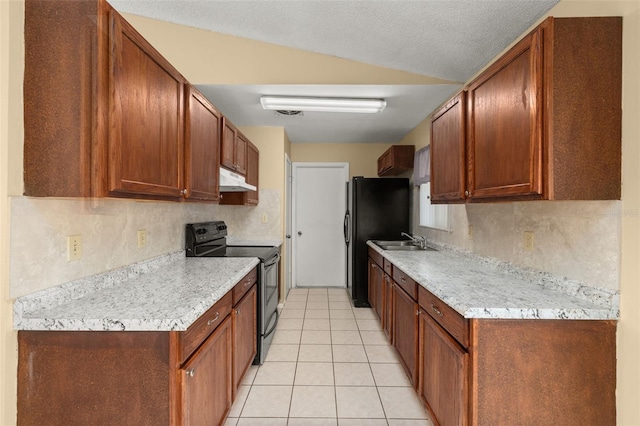 kitchen featuring light tile patterned floors, sink, backsplash, black appliances, and a textured ceiling