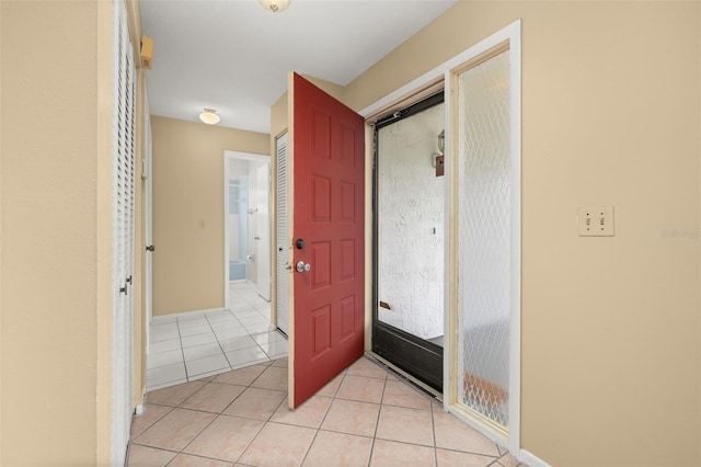 foyer with light tile patterned floors