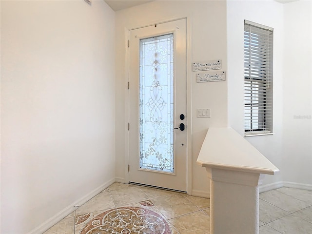 entryway with light tile patterned flooring