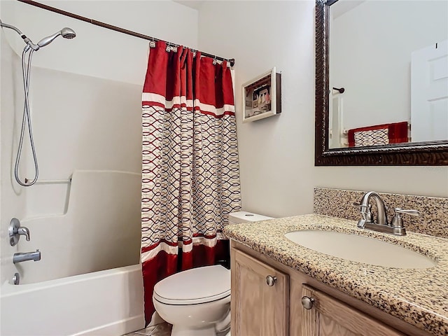 full bathroom with shower / tub combo with curtain, vanity, and toilet