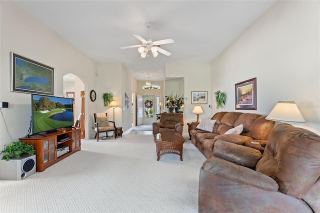 carpeted living room with ceiling fan