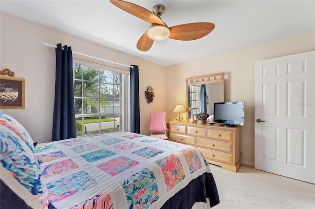 carpeted bedroom featuring ceiling fan