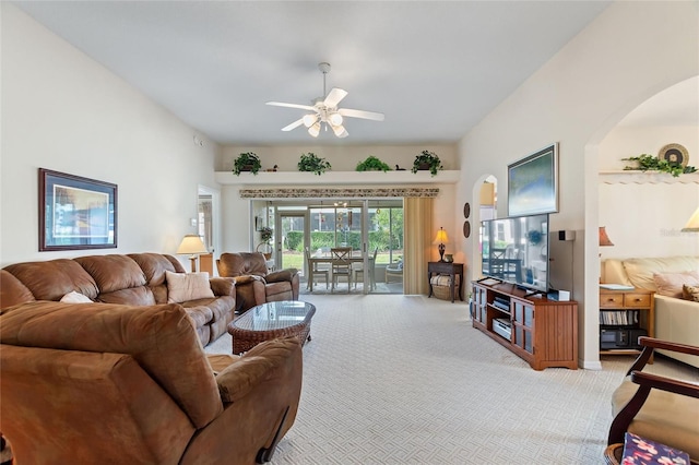 living room with light colored carpet and ceiling fan