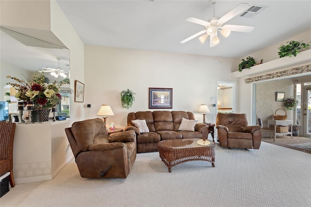 living room with light carpet and ceiling fan